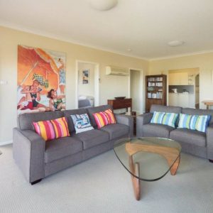 Front living room & balcony at Southerly Change, Gerroa holiday house accommodation at Seven Mile Beach, NSW